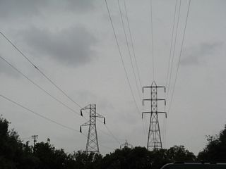 Three sets of powerlines cross over California 162, each with their own unique tower design. These lines carry power past the Oroville Dam complex south.