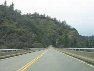 The narrow, two-lane Canyon Creek Bridge carries California 162 north over this branch of Lake Oroville.