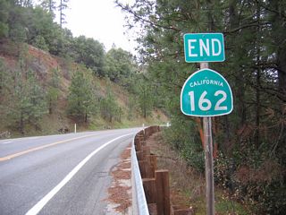 At Foreman Creek Road, eastbound California 162 comes to a seemingly abrupt end. The state only built California 162 this far east; from here northeast to Quincy, the Oroville-Quincy Highway is county maintained. This easternmost segment of California 162 is a product of the Lake Oroville project; the bridges and cuts needed to route a highway above the lake level was done by the state as part of the State Water Project.