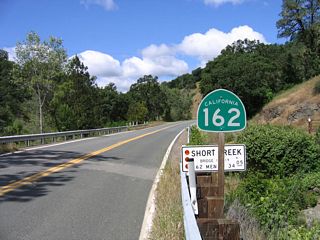 The first shield for California 162 west in Mendocino County is posted here, at the Short Creek bridge along Mendocino Pass Road. California 162 travels west to Covelo, turns south to cross the Poonkinny Ridge, crosses the ridge in a westerly direction to Dos Rios, then aims south and west to meet U.S. 101 near Longvale alongside the Middle Fork of the Eel River.