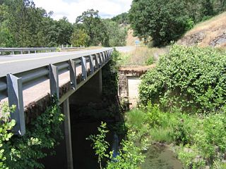 This view shows the underside of the 1962 Short Creek bridge along California 162 west. Remnants of an older bridge approach can be seen.