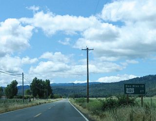 Upon leaving Covelo, a mileage sign provides the distance to Dos Rios (12 miles) and U.S. 101 (27 miles).