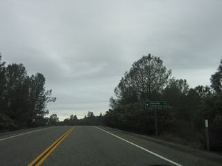 Westbound California 162 approaches the turnoff to Forbestown Road  en route to Forbestown (14 miles) and Feather Falls (18 miles).