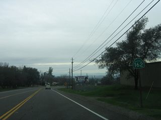 A California 162 west reassurance shield is posted after the CR B-2 intersection.
