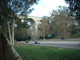 The Cabrillo Bridge opened in 1915 well before the freeway was constructed; SR 163 (then known as U.S. 395) was built in the 1940s, and it was one of the first freeways to be constructed in San Diego.