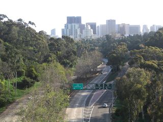 Downtown San Diego and Marston Point are visible from the Cabrillo Bridge beyond the Cabrillo Freeway. Overheads at the south end of SR 163 were replaced by 2006.