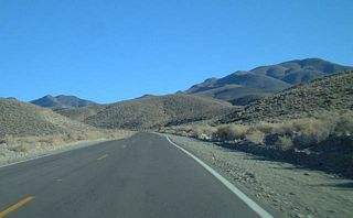 The White Mountains loom as California 168 continues east.