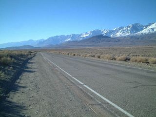 The dominating and majestic eastern slope of the Sierra Nevada Mountains as seen along westbound California 168in Deep Springs Valley.
