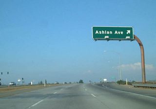 Eastbound California 168 (Sierra Freeway) reaches Exit 3, Ashlan Avenue. The freeway turns northeast between Exits 3 and 7.