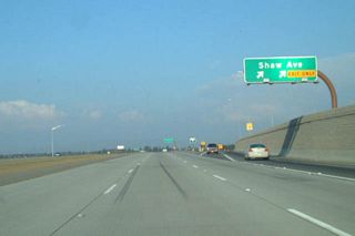 Eastbound California 168 (Sierra Freeway) reaches Exit 4, Shaw Avenue.