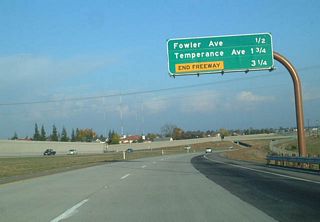 Eastbound California 168 (Sierra Freeway) approaches Exit 8, Fowler Avenue, one-half mile.