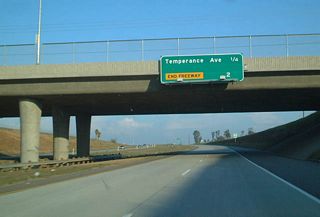 Eastbound California 168 (Sierra Freeway) approaches Exit 9, Temperance Avenue, one-quarter of a mile.