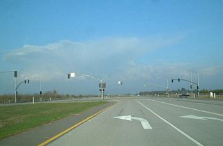 California 168 shifts from the Sierra Freeway onto an expressway alignment at the traffic signal for Tollhouse Road. The divided expressway continues for a short distance, and then the highway reverts to two lanes. Originally, California 168 was routed along Tollhouse Road all the way into downtown Clovis.