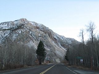 Westbound California 168 enters the unincorporated community of Aspendell.