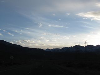 A pair of Los Angeles Department of Water and Power transmission lines cross over California 168. One is a high-voltage direct current line connecting Celilo Converter Station near The Dalles, Oregon, and Sylmar Converter Station in Los Angeles (part of Path 65). The other brings power generated along the Owens River south to Los Angeles.
