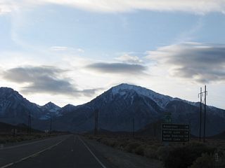 This mileage sign along California 168 west provides the distance to the following four destinations: Aspendell (12 miles), North Lake (14 miles), Lake Sabrina (14 miles), and South Lake (17 miles via South Lake Road). The state route ends just west of Aspendell.