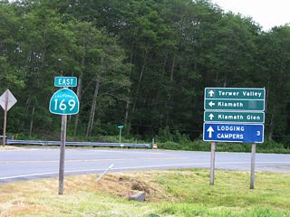 This is the first shield for California 169 after leaving U.S. 101 Exit 769. This short section of California 169 acts as a spur route, leading southeast to Klamath and Klamath Glen along the north bank of the Klamath River. California 169 is a split route, with this section traveling only to Klamath Glen, and another section follows the river along Martins Ferry Road from California 96 (at Weitchpec) northwest to Johnsons. The missing link is unlikely to be built due to the terrain and proximity to the river. Nevertheless, both extant sections are signed as California 169, and proposed route is shown on the state official maps between Johnsons and Klamath Glen (despite the fact it is very unlikely to be built).