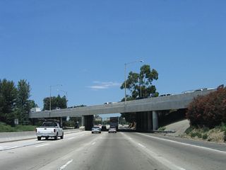 As California 170 north passes under the transition ramp to U.S. 101 (Ventura Freeway), a high occupancy vehicle lane begins. This lane will remain for the entire length of the California 170 freeway.