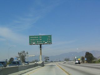 This mileage sign along northbound California 170 provides the distance to three of the next four exits. The first on the list is Exit 11A, Sheldon Street, but the other two are actually on northbound Interstate 5 (Golden State Freeway): Exit 154, Osbourne Street and Exit 155A, Terra Bella Street. Interstate 5 is not listed on this mileage sign since all through traffic must merge onto the Golden State Freeway.