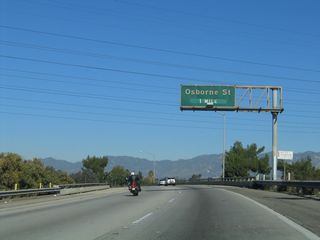 The next exit along northbound Interstate 5 after the two freeways merge together is with Exit 154, Osbourne Street.