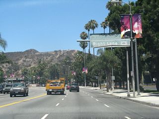 An old U.S. 101 overhead guide sign is posted along northbound California 170 (Highland Avenue) prior to the Odin Street traffic signal.