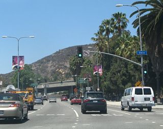 Northbound California 170 (Highland Avenue) meets Odin Street at this traffic signal.