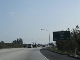 The first southbound reassurance sign for California 170 includes the name Hollywood Freeway. This storied freeway travels south from Interstate 5 (Golden State Freeway) to the Four-Level Interchange (junction between the Santa Ana, Harbor, and Pasadena Freeways, or between Interstate/California 110 and U.S. 101).