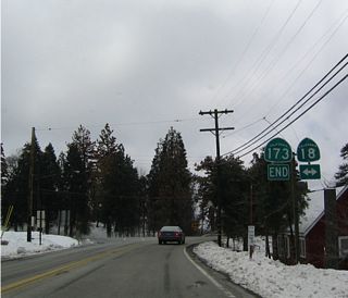 California 173 concludes at a stop sign with California 18 (Rim of the World Highway) in Crest Park. Winter storms commonly bring snow to the San Bernardino Mountains during the months of December through March.