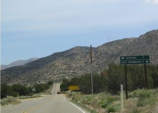 A left turn on Arrowhead Lake Road heads north into Hesperia, connecting with Main Street and Interstate 15 Exit 143. Meanwhile, California 173 continues east toward its dirt road segment.