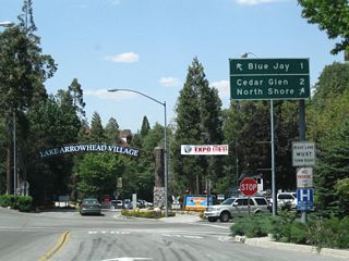 Westbound California 173 approaches the junction with California 189 and the entrance to Lake Arrowhead Village. Turn left for California 189 west to Blue Jay and Twin Peaks; turn right for the continuation of California 173 northwest to the eastern and northern shores of Lake Arrowhead. Continue straight ahead into the Lake Arrowhead Village, which features outlet shops, restaurants, and views of the lake. Note the lack of any state highway shields at this complicated intersection.