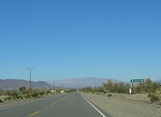 The second turn-off after the Riverside County Route R-2/Kaiser Road intersection is for Oasis Road. Oasis Road travels west to Lake Tamarisk, where it meets Riverside County Route R-2.