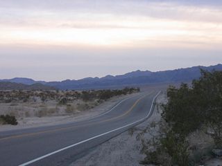 With the Coxcomb Mountains rising in the distance, California 177 briefly travels southwest before turning south generally to follow the Colorado River Aqueduct toward Desert Center and Interstate 10.