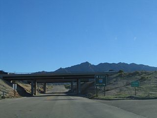 Skipping ahead, southbound California 177 approaches its southern terminus in Desert Center. The junction with Interstate 10 is a standard diamond interchange, and an end shield is posted on southbound underneath the twin bridges that carry Interstate 10 overhead.