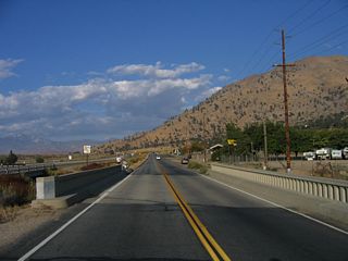 Continuing east, Lake Isabella Boulevard (old California 178) crosses an old bridge with concrete railing. This bridge crosses the Borel Canal, which carries water from Lake Isabella to the Borel hydroelectric power station southwest of Bodfish. The Borel Canal bridge was built in 1948.