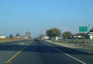 California 180 enters Kerman.