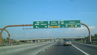 Eastbound California 180 (Kings Canyon-Sequoia Freeway) reaches Exit 60A, eastbound California 168 (Sierra Freeway). The next exit is Exit 60B, Cedar Avenue.