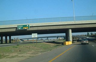 This photo shows the transition from eastbound California 180 (Kings Canyon-Sequoia Freeway) to eastbound California 168 (Sierra Freeway), with a view of Exit 60B, Cedar Avenue.