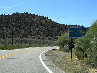 Leaving the Silver State, Nevada State Route 338 ends and California State Route 182 begins. While a welcome to California sign is posted at the state line, there is no initial reassurance shield for California 182. Additionally, there are no southbound reassurance shields except the end shield at U.S. 395 in Bridgeport.