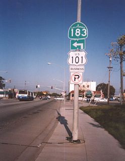 SR 183 (Market Street) southbound at U.S. 101 Business (Monterey Street) prior to the construction of the City of Salinas Downtown Parking Garage on the southwest corner.