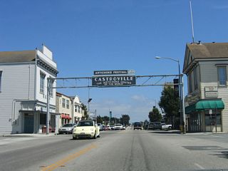 California 183 passes under the Castroville arch, located at the intersection with Preston Street.