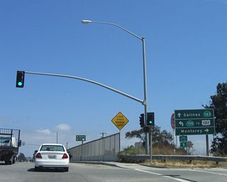 Shortly thereafter, southbound California 183 meets California 156. The first ramp connects to California 156 west to California 1 south to the Monterey Peninsula (cities of Marina, Seaside, Monterey, Pacific Grove, and Carmel-by-the-Sea). The next left is for California 156 east to Prunedale and U.S. 101 (El Camino Real). Continue straight ahead to follow California 183 (Merritt Street) south to Salinas.