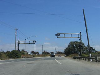 California 183 continues southeast across these decommissioned railroad tracks. However, a set of active railroad tracks closely parallels California 183 to the northeast of the state route.