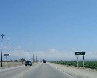 Entering the lush agricultural lands of the Salinas Valley, California 183 passes by multiple farms and ranches on its journey southeast toward Salinas, which is seven miles from this point.