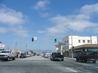 Southbound California 183 meets U.S. 101 Business (Monterey Street) at this traffic signal. Turn left to continue south on California 183; continue straight ahead to follow Market Street to U.S. 101 south.