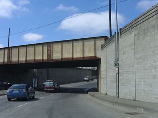 Embedded into the wall is a notch for a light post and a U.S. 101 Business reassurance shield. California 183 is not signed here (but will be shortly).