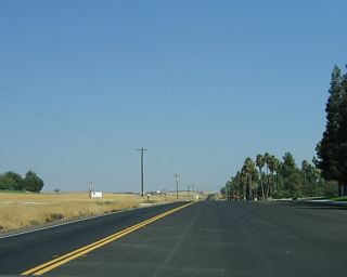 The highway quickly reduces to two lanes.