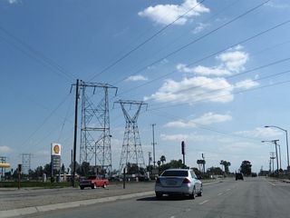 A pair of high-voltage transmission towers pass over both California 184 and California 58. This view is just south of the California 58-184 interchange.