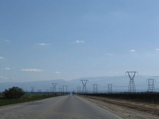 Three single-circuit Southern California Edison 220kV power transmission lines cross over Wheeler Ridge Road. These lines will eventually share alignment with Path 26, part of the major north-south power transmission corridor between Northern California and Southern California.