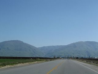 Southbound Wheeler Ridge Road approaches Wheeler Ridge and Interstate 5. Gas and food are available at the interchange, which is signed for Laval Road.
