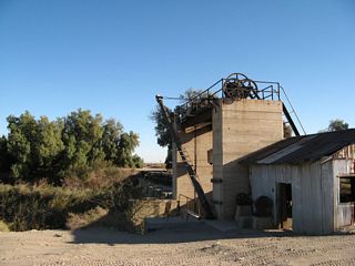 An old wooden bridge at Hanlon Heading crosses the diversion gate on the south side, and the building associated with the structure is in disrepair.
